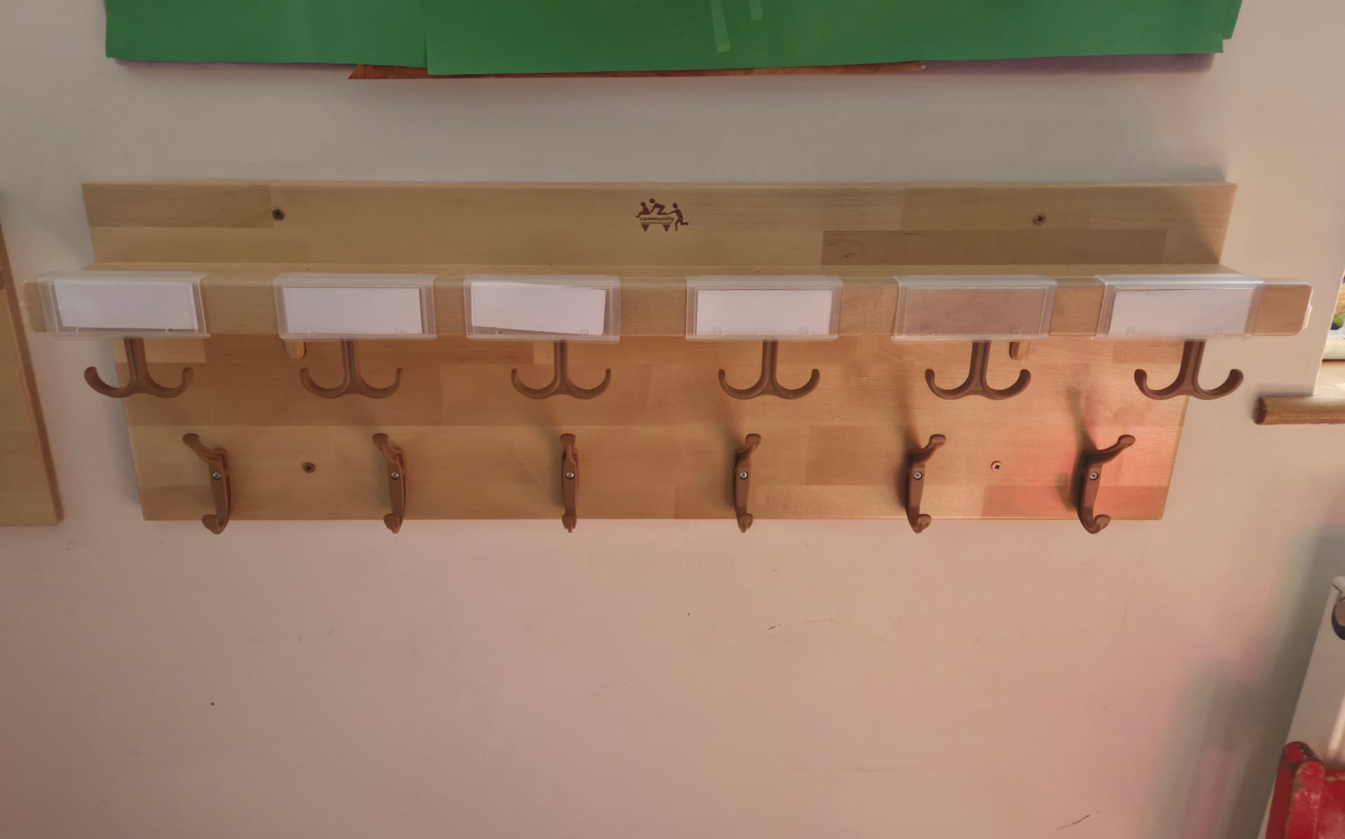 This is where the children put their bags, coats and water bottles, with their own dedicated hook and picture label