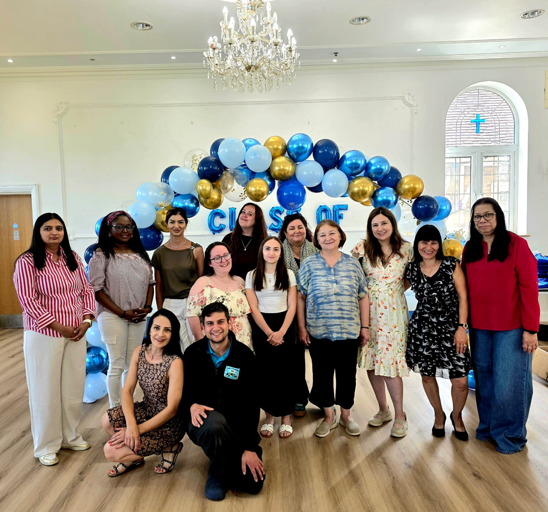 The SPNS team together at a celebration
